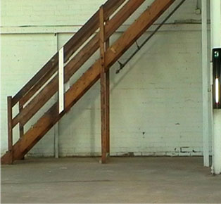 photograph of wooden stairs where speaker was placed